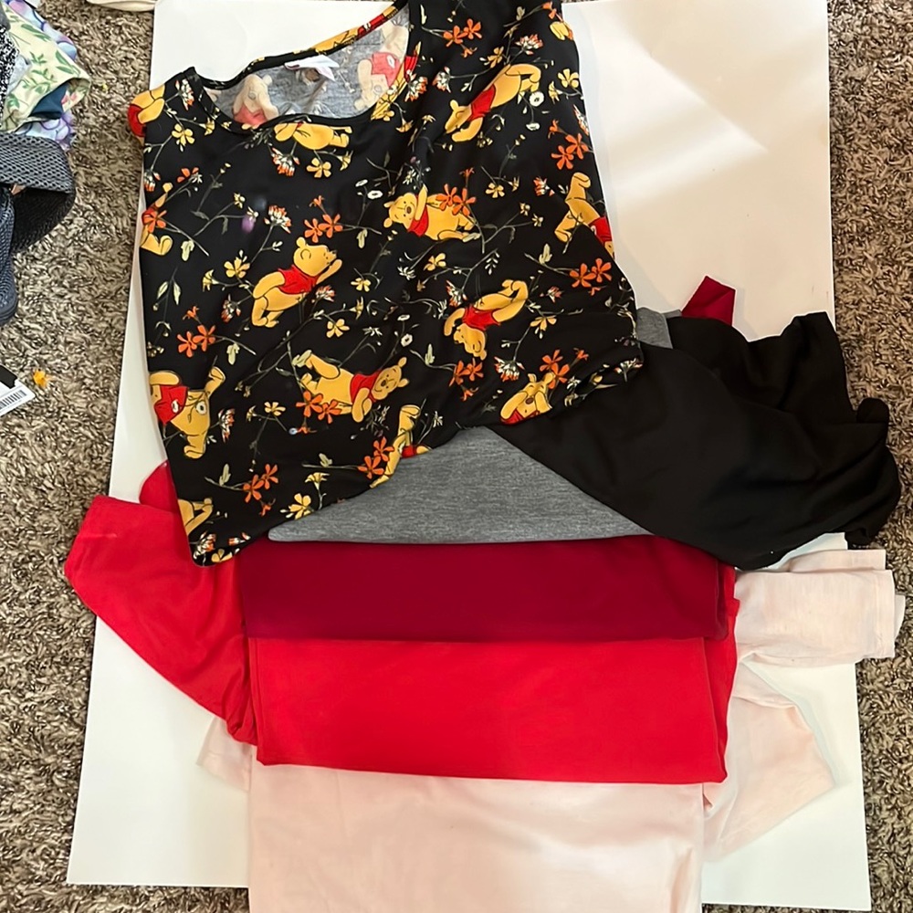 A collection of Lularoe Irma tops great solids and a Disney Winnie the Pooh!